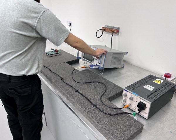 Technical training session with engineers reviewing test procedures